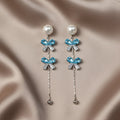 SVORA pearl stud aqua drop dangler earrings with blue crystal clusters and baguette cubic zirconia.