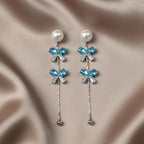 SVORA pearl stud aqua drop dangler earrings with blue crystal clusters and baguette cubic zirconia.