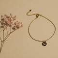 SVORA petite gold plated stainless steel bracelet with circle drop charm and lobster clasp.