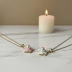SVORA pink enamel pearl flower necklace with gold chain, delicate floral pendant with faux pearl center.