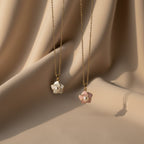 SVORA pink enamel pearl flower necklace with gold chain, delicate floral pendant with pearl center.