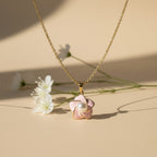 SVORA pink enamel pearl flower necklace with 18k gold-plated stainless steel chain.