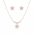 SVORA pink crystal flower necklace and stud earrings set with pearl and CZ accents on gold chain.