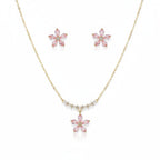 SVORA pink crystal flower necklace and stud earrings set with pearl and CZ accents on gold chain.