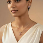 SVORA gold-tone necklace and earrings set with pink crystal flower pendants and pearl accents.