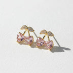 SVORA gold tone stud earrings with pink heart crystals and clear crystal accents, shaped like cherries.
