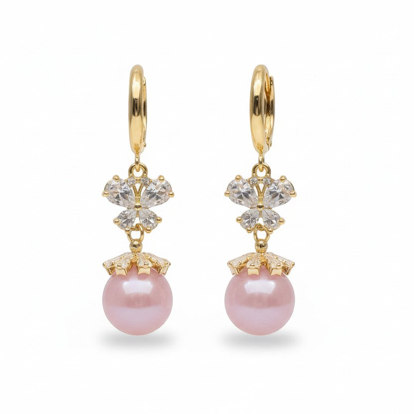 SVORA pink pearl butterfly dangle earrings with gold hoops and clear crystals.
