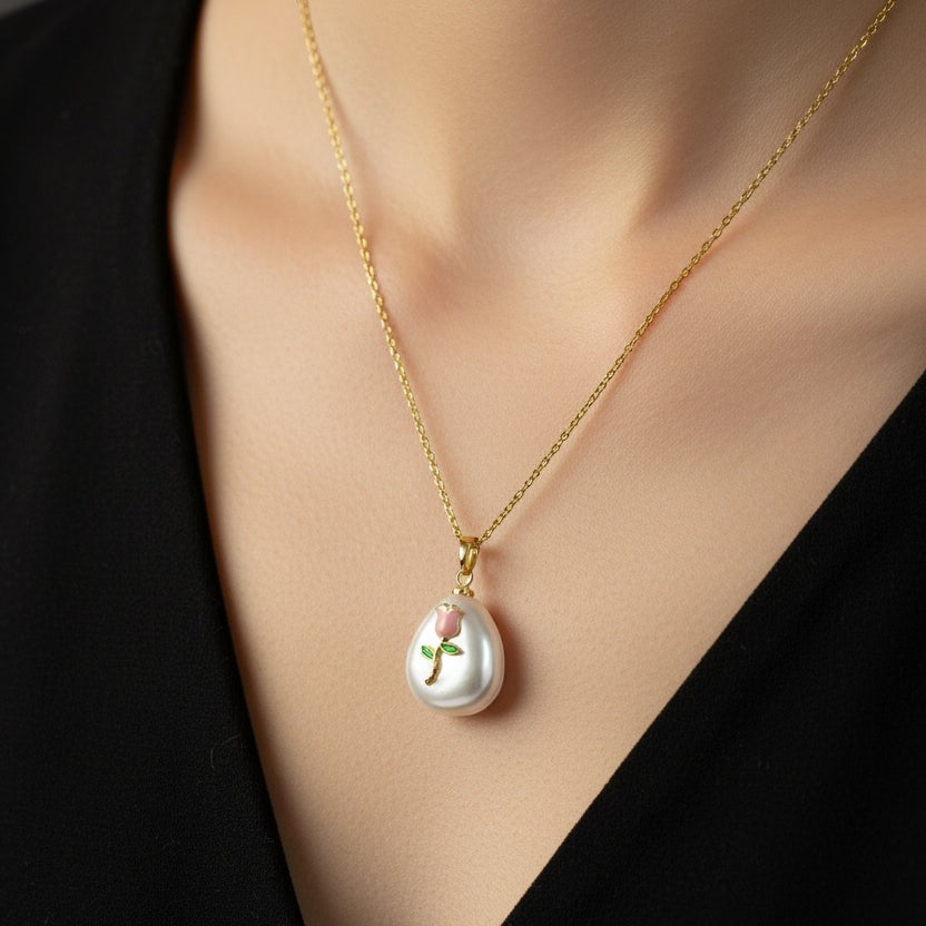 SVORA pink rose pendant necklace with pearl and gold stem on a fine gold chain.