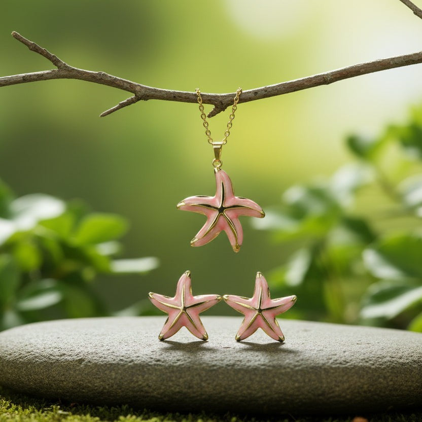 SVORA pink enamel starfish necklace and earrings set with gold-tone accents, perfect for beachwear.