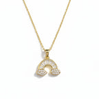 SVORA gold plated stainless steel necklace with a rainbow pendant adorned with baguette and pave crystals.