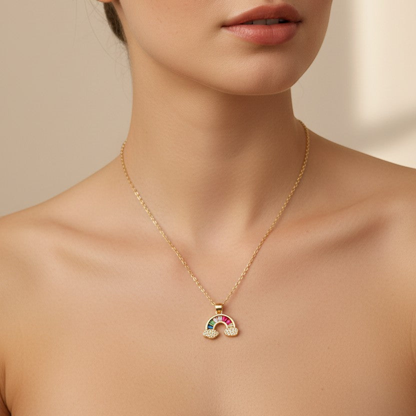 SVORA gold plated stainless steel rainbow necklace with colorful stones and pave diamond clouds.