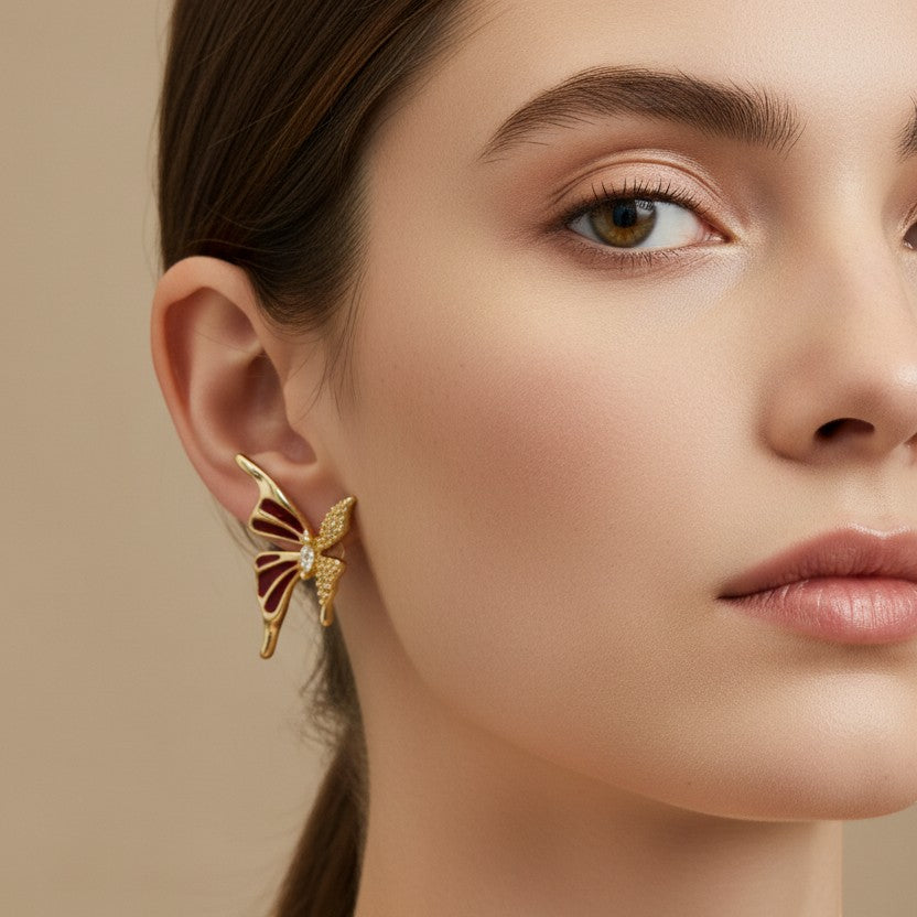 SVORA red butterfly stud earrings with burgundy enamel wings, cubic zirconia accents, and a marquise-cut center crystal.