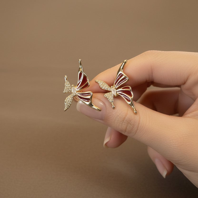 SVORA red butterfly stud earrings with gold plating and cubic zirconia accents