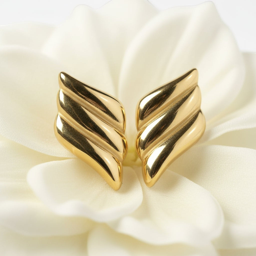 SVORA gold ribbed dome sculptural stud earrings with deep ridge work and high polish.