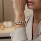 SVORA rose gold pavé Cuban link statement bracelet with white CZ stones on a woman's wrist.