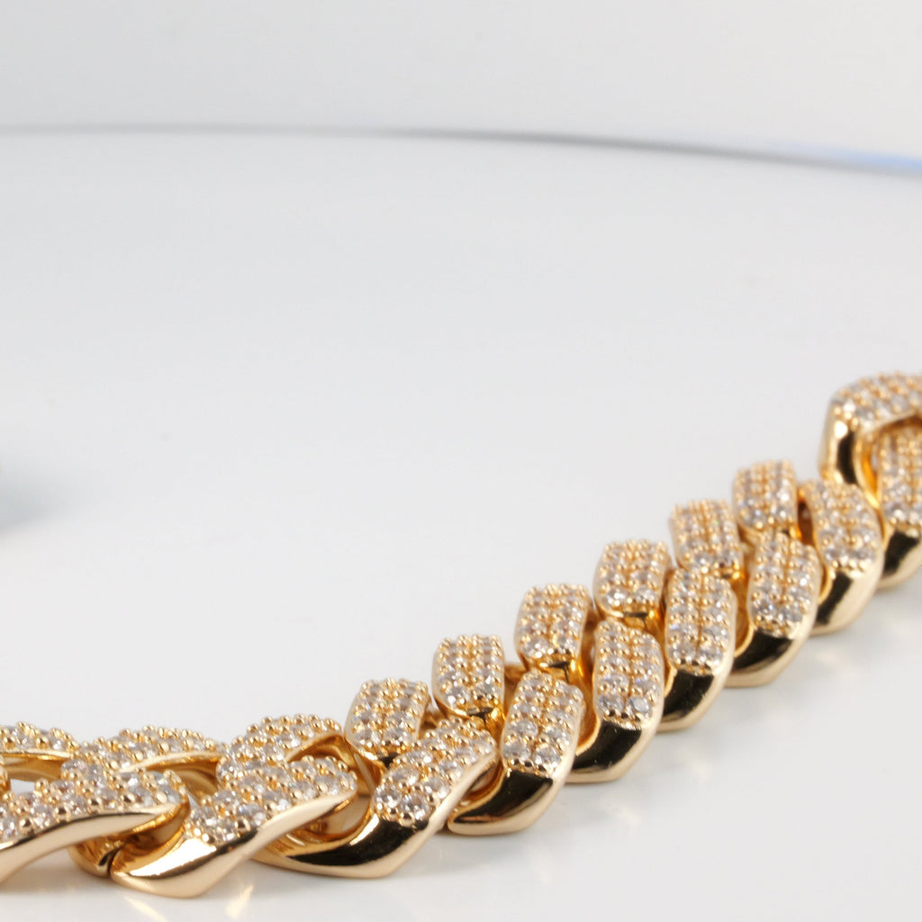 SVORA rose gold Cuban link statement bracelet with pavé white CZ stones and a secure box clasp.