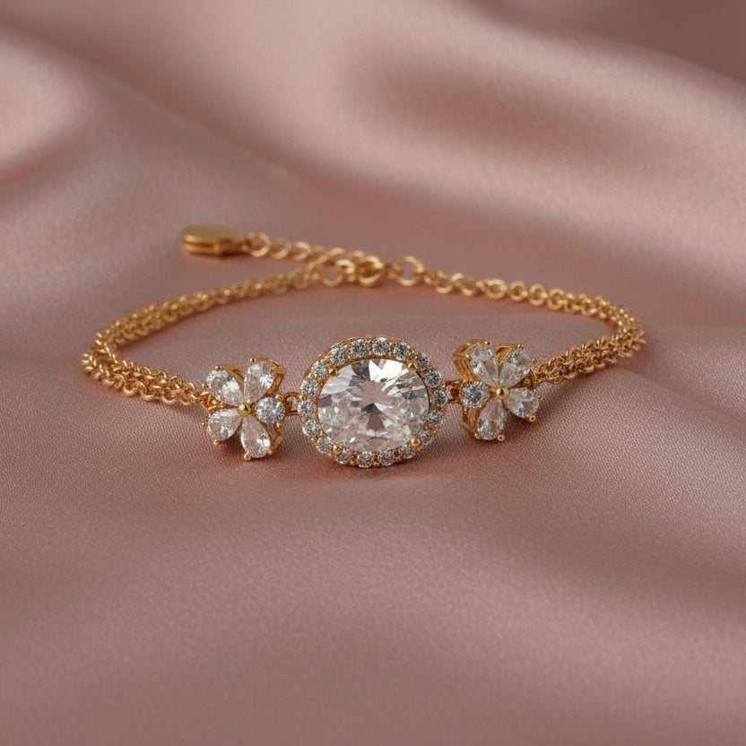 SVORA rose gold layered bracelet with oval white CZ center and flower accents. Adjustable.