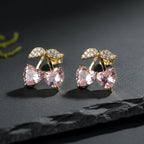 SVORA gold tone stud earrings with pink heart crystals and small leaf detail with clear cubic zirconia.