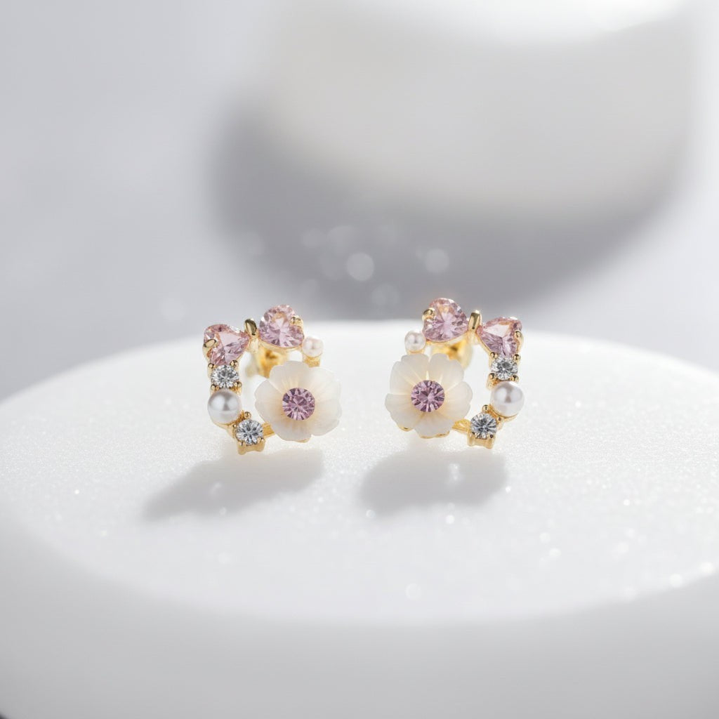 SVORA Rose Pearl Bow Stud Earrings with pink crystals, pearls, and cubic zirconia on a gold-tone setting.