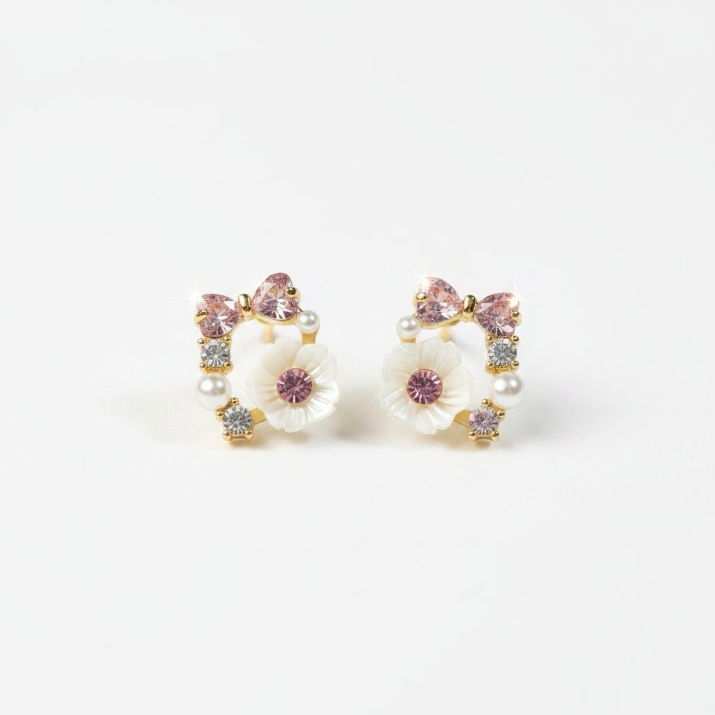 SVORA rose pearl bow stud earrings with pink crystals, mother-of-pearl florets, and cubic zirconia accents.