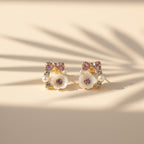 SVORA rose pearl bow stud earrings with pink crystals, mother-of-pearl florets, and cubic zirconia accents.