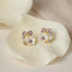 SVORA Rose Pearl Bow Stud Earrings with pink crystals, pearls, and mother-of-pearl florets.