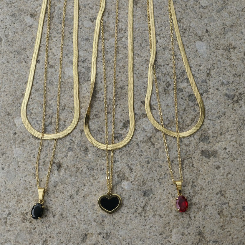 SVORA gold layered necklace with ruby red oval pendant and snake chain