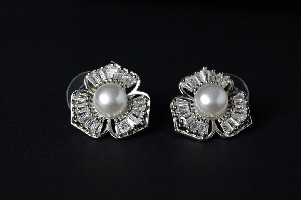 SVORA Silver petal pearl stud earrings with baguette cubic zirconia petals and a freshwater pearl center.