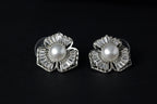 SVORA Silver petal pearl stud earrings with baguette cubic zirconia petals and a freshwater pearl center.