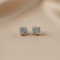 SVORA silver square stud earrings with interlocking design and cubic zirconia stones.