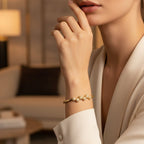 SVORA gold plated stainless steel bangle bracelet with six pavé cubic zirconia domes. Modern, waterproof jewelry.