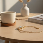SVORA Solitaire Oval Layered Bracelet with white CZ stones and rose gold plated chain, perfect for bridal or evening wear.
