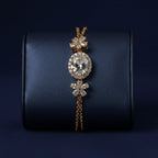 SVORA Solitaire Oval Layered Bracelet with white CZ center, halo, and flower accents on rose gold chain.