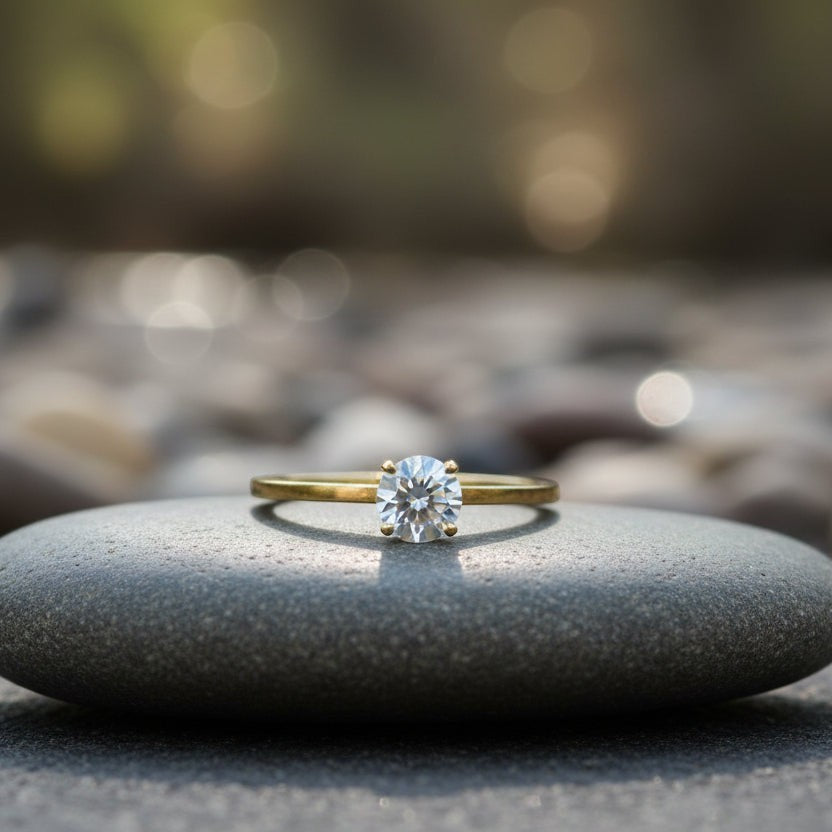 SVORA Lumiere Whisper Solitaire Ring in gold-tone stainless steel with cubic zirconia. Simple, elegant, and stackable.