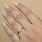 SVORA Lumiere Whisper Solitaire Ring in gold tone, featuring a round cubic zirconia set in 316L stainless steel with 18K gold plating.