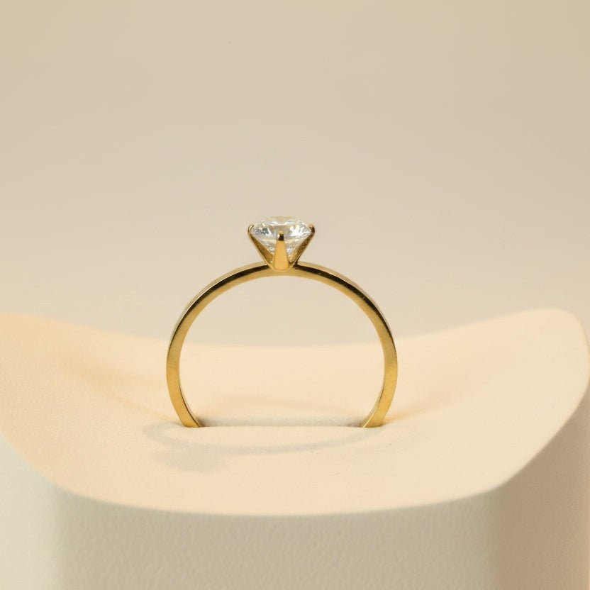 SVORA Lumiere Whisper Solitaire Ring in gold-tone stainless steel with a crystal white cubic zirconia.