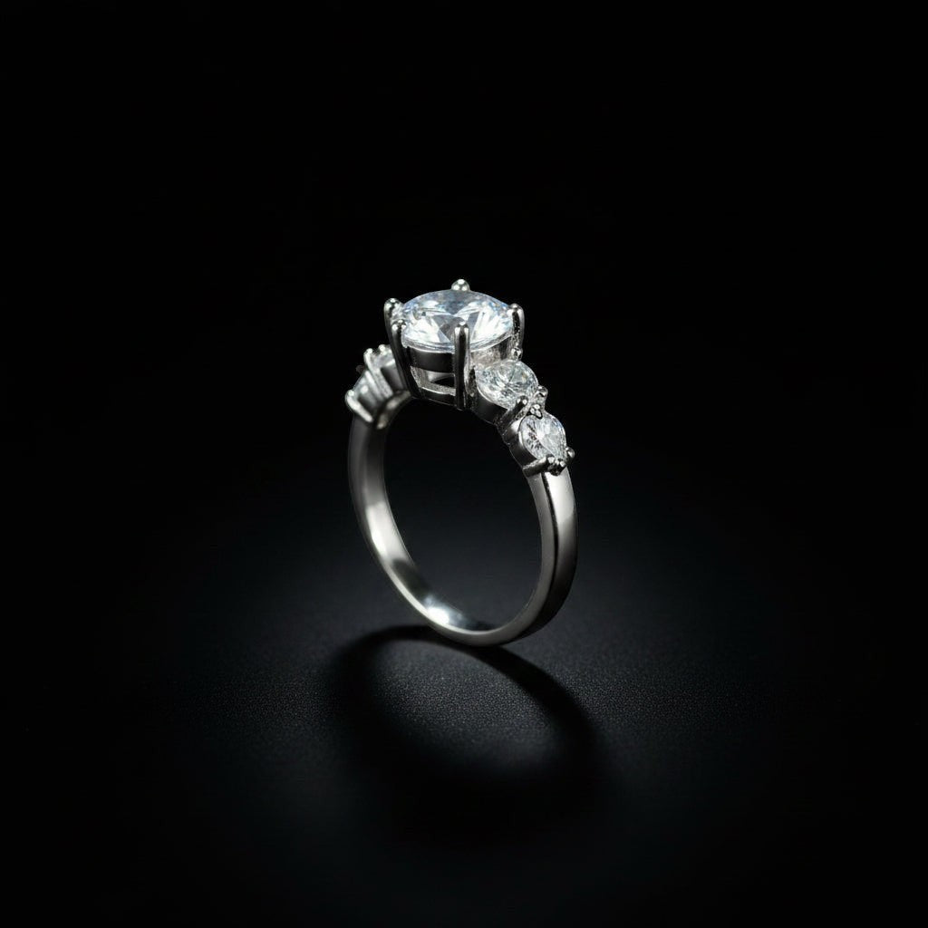 SVORA Ethereal Amour Solitaire Ring with round-brilliant center stone and heart-cut accent stones, rhodium-plated stainless steel.
