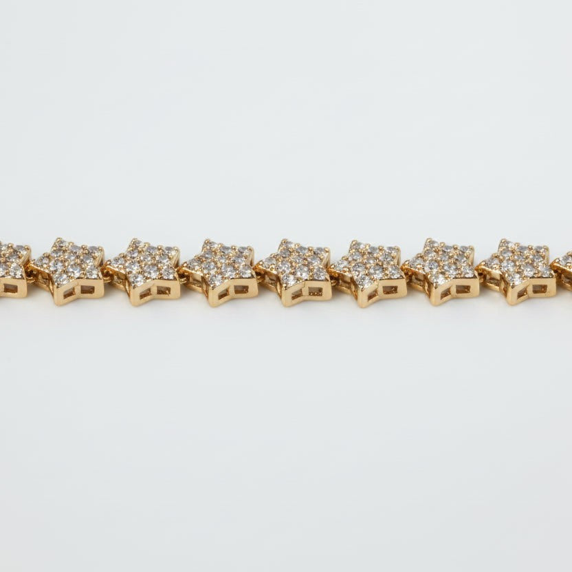 SVORA gold plated stainless steel tennis bracelet with pavé CZ stars and a fold-over clasp.