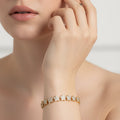 SVORA gold-plated stainless steel tennis bracelet with pavé CZ stars and a fold-over clasp.