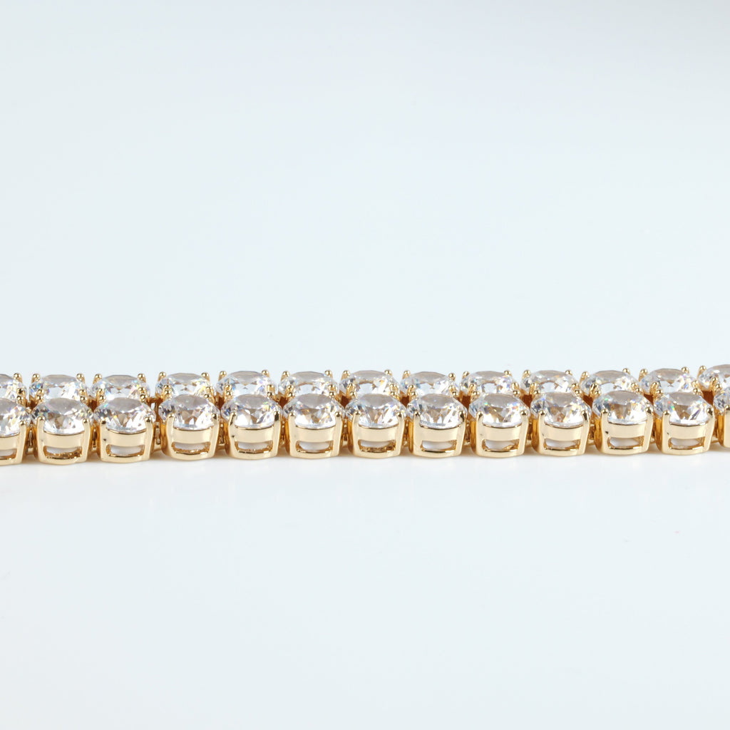 SVORA gold plated stainless steel tennis bracelet with two rows of large round white CZ stones and a fold-over clasp.