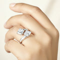 SVORA Toi et Moi ring with two princess-cut clear stones and channel-set baguettes on a rhodium-plated band.
