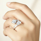 SVORA Toi et Moi ring with two princess-cut clear stones and channel-set baguettes on a rhodium-plated band.