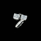 SVORA Toi et Moi ring with two princess-cut clear stones and channel-set baguettes on a rhodium-plated band.