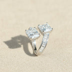 SVORA Toi et Moi ring with two princess-cut clear stones and channel-set baguettes on a rhodium-plated band.