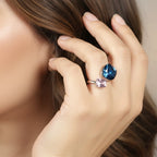 SVORA Toi et Moi Velvet Tanzanite Ring with blue cushion and purple cube stones on a silver band.