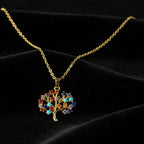 SVORA gold plated stainless steel necklace with a multicolor Tree of Life pendant adorned with amber, blue, turquoise, and amethyst CZ stones.