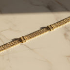 SVORA Triple Layer Tennis Bracelet with gold-tone finish and cubic zirconia stones.