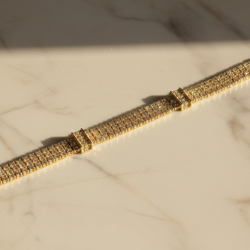 SVORA Triple Layer Tennis Bracelet with gold-tone finish and cubic zirconia stones.