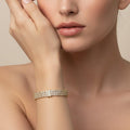 SVORA Triple Layer Tennis Bracelet with three rows of cubic zirconia stones in a gold-tone finish.
