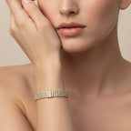 SVORA Triple Layer Tennis Bracelet with three rows of cubic zirconia stones in a gold-tone finish.